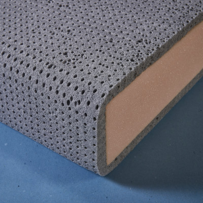 Latex Wrap being fitted to the top of a cushion